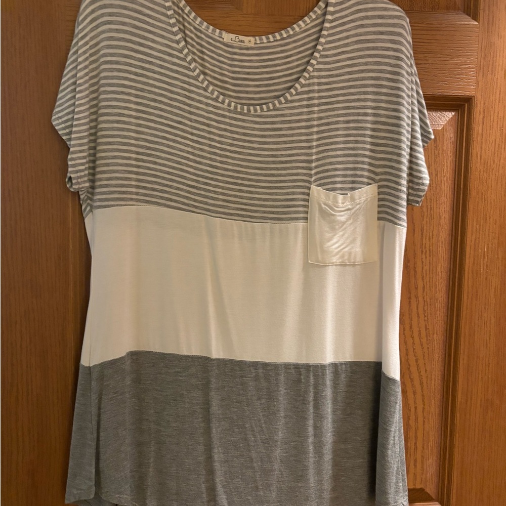 Tunic style short sleeved top. Color block style. Gray and white with stripes.